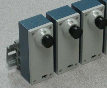 Three Miniature Trainable Vision Sensors mounted on a DIN rail
